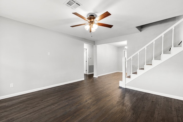 unfurnished living room with dark hardwood / wood-style flooring and ceiling fan