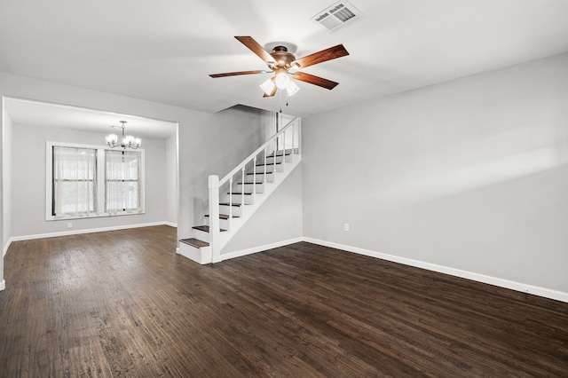 unfurnished living room featuring dark hardwood / wood-style floors and ceiling fan with notable chandelier