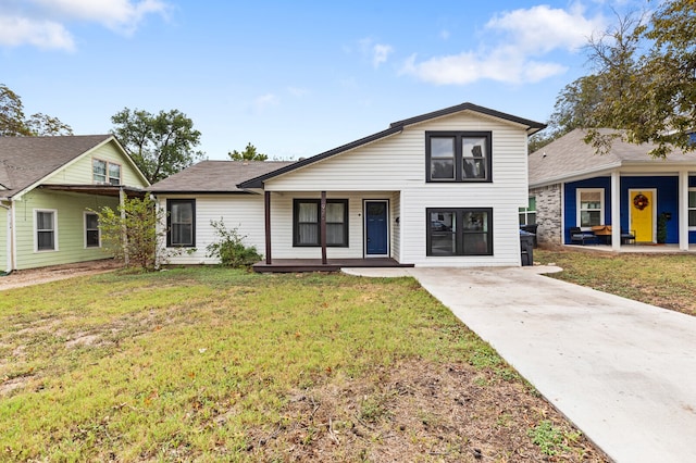 view of front of home featuring a front yard and covered porch