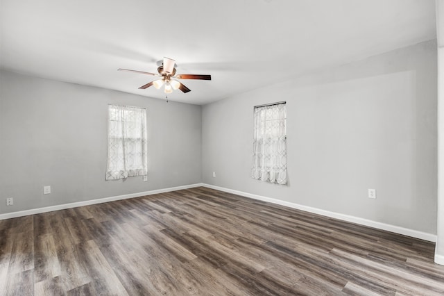 unfurnished room featuring dark hardwood / wood-style flooring and ceiling fan