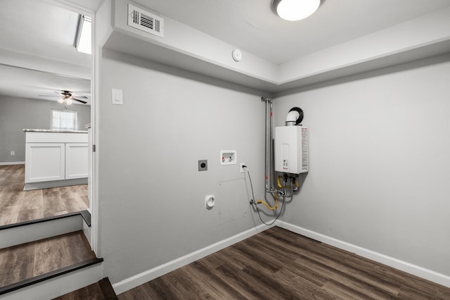 washroom featuring dark hardwood / wood-style flooring, electric dryer hookup, ceiling fan, tankless water heater, and hookup for a washing machine