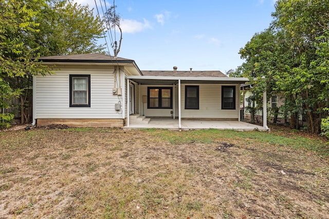 rear view of house featuring a patio