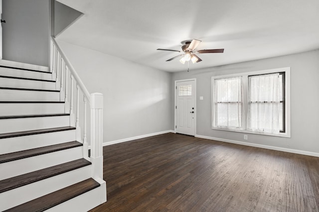 entryway with dark wood-type flooring and ceiling fan