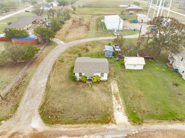 birds eye view of property with a rural view