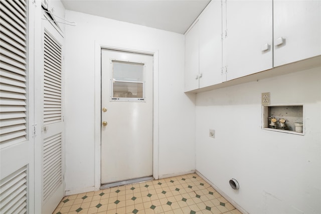 washroom featuring cabinets, hookup for a washing machine, and hookup for an electric dryer