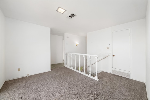 unfurnished room with carpet flooring