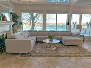 living room featuring tile patterned flooring and a healthy amount of sunlight