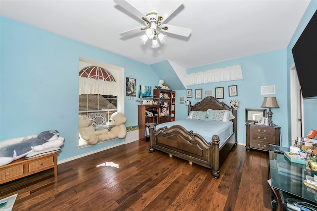 bedroom with ceiling fan and dark hardwood / wood-style floors