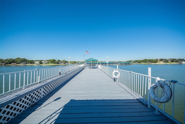 view of dock featuring a water view and a gazebo