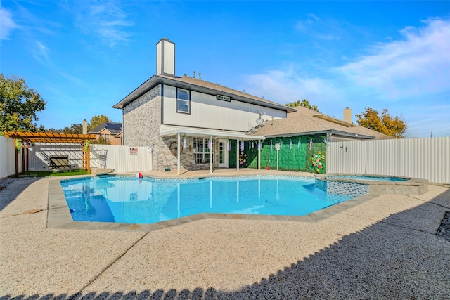 view of swimming pool with a pergola, an in ground hot tub, and a patio area