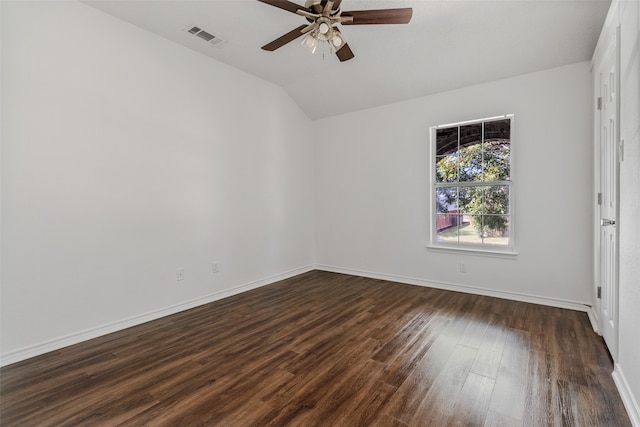 empty room with dark wood-type flooring, ceiling fan, and lofted ceiling