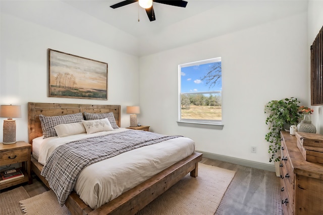 bedroom with ceiling fan and wood-type flooring