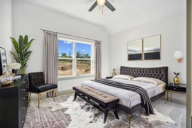 carpeted bedroom with vaulted ceiling and ceiling fan