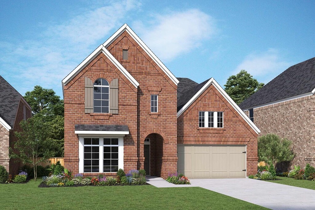 front facade with a garage and a front yard