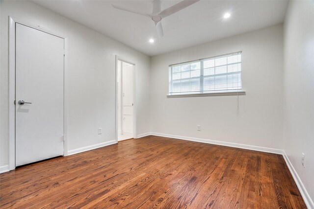 unfurnished bedroom featuring hardwood / wood-style flooring and ceiling fan