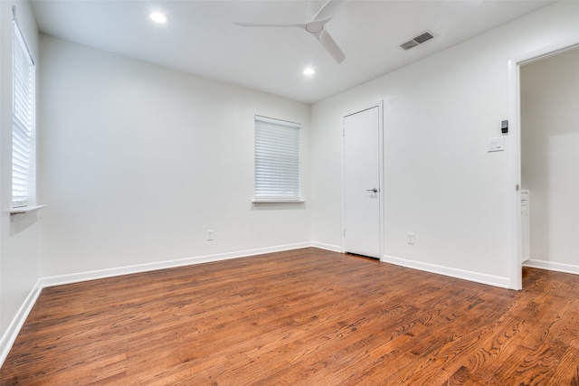 unfurnished room with wood-type flooring and ceiling fan