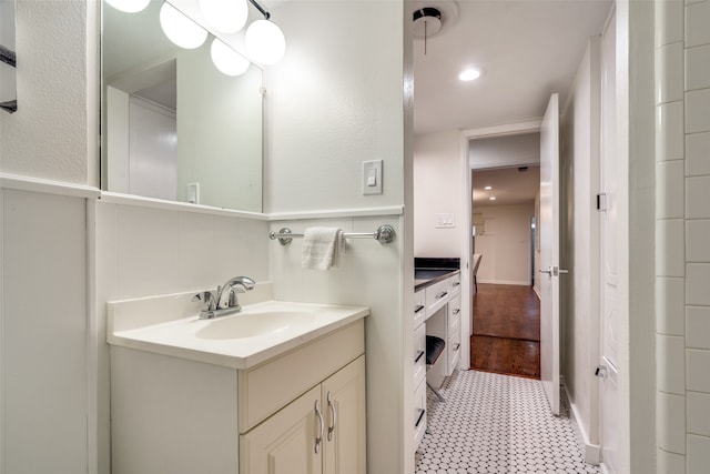 bathroom with vanity and wood-type flooring