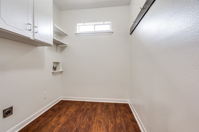 laundry room featuring cabinets, hookup for a washing machine, hookup for an electric dryer, and dark wood-type flooring