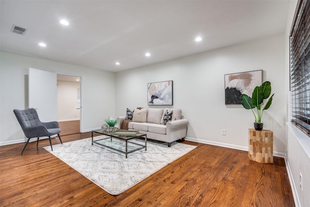 living room with dark hardwood / wood-style floors