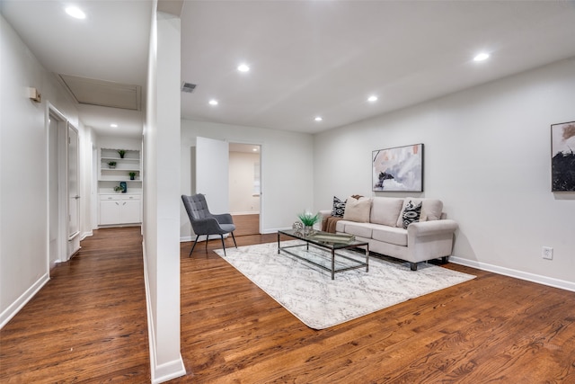 living room with dark hardwood / wood-style flooring