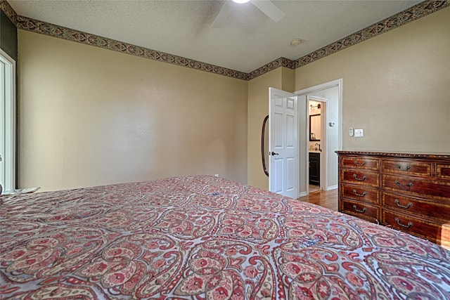 bedroom with hardwood / wood-style floors and ceiling fan