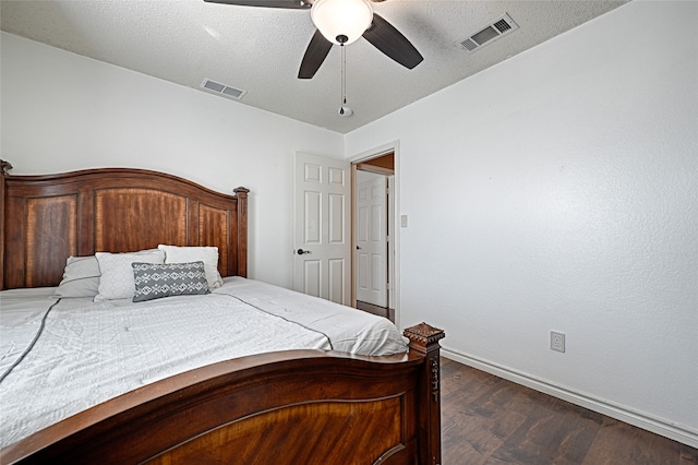 bedroom featuring a textured ceiling, ceiling fan, and dark wood-type flooring