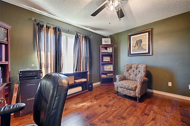 office with a textured ceiling, ceiling fan, and dark wood-type flooring