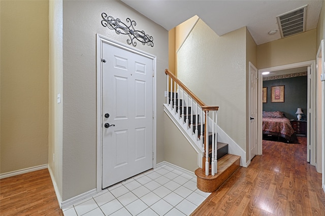 foyer entrance with light hardwood / wood-style flooring