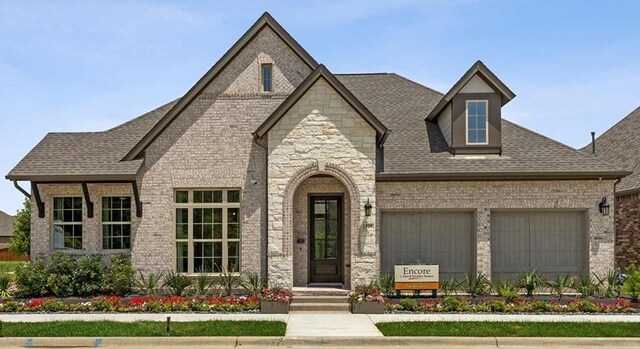 4850 Prairie Crest Ln, Arlington, TX 76005 - french country style house featuring a garage