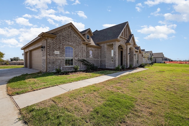 view of front of home with a garage and a front yard