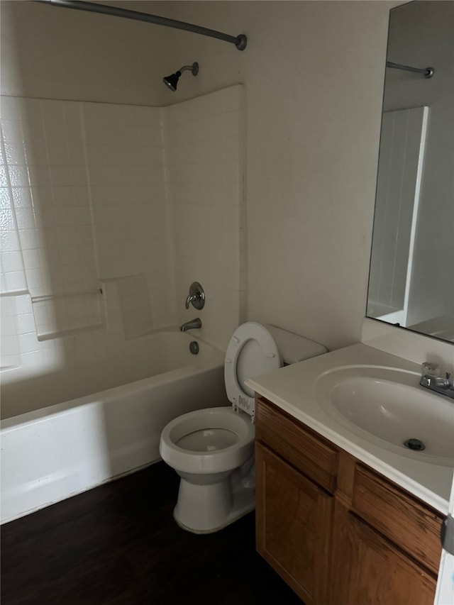 full bathroom with vanity, shower / bath combination, toilet, and hardwood / wood-style flooring