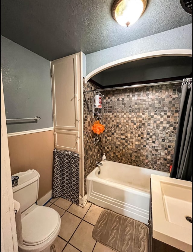 full bathroom with vanity, toilet, tile patterned floors, and shower / bath combination with curtain