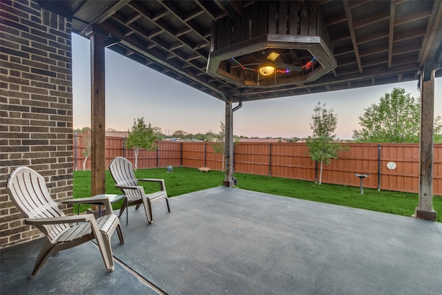 patio terrace at dusk with a yard