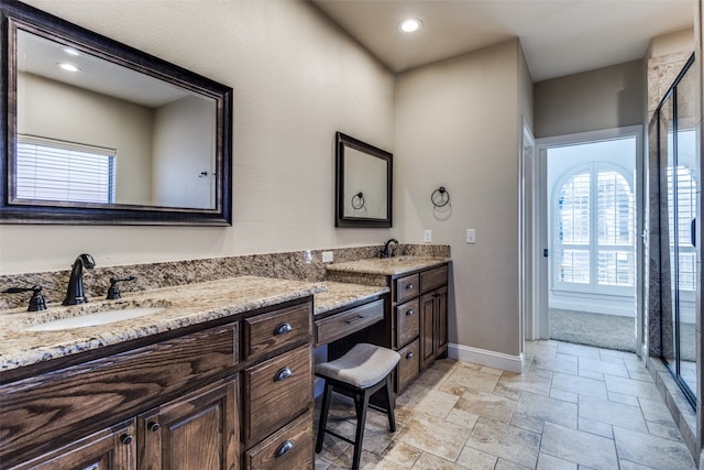 bathroom with vanity and an enclosed shower