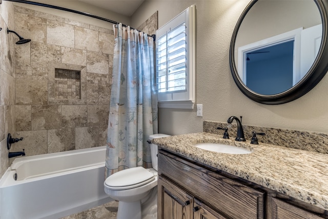 full bathroom with vanity, shower / bath combo, and toilet