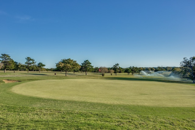 surrounding community featuring a water view