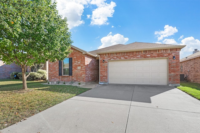 single story home featuring a front yard and a garage