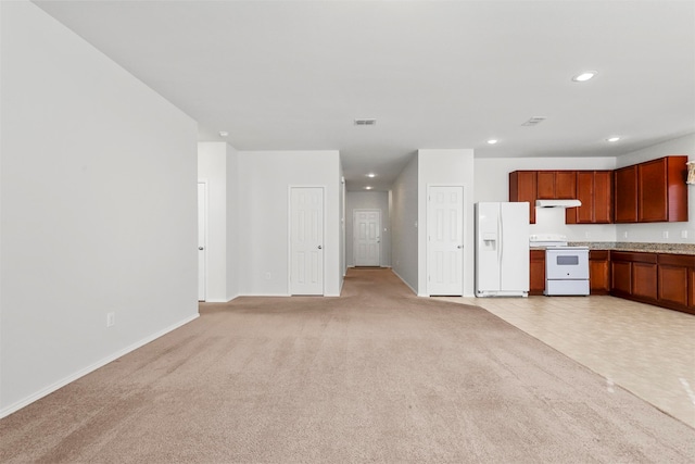 unfurnished living room featuring light carpet