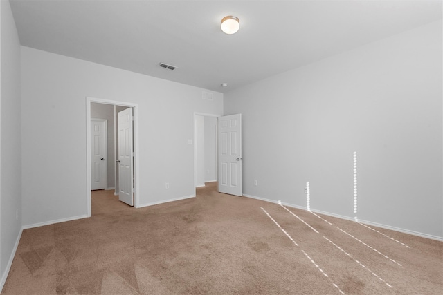 unfurnished bedroom with light carpet