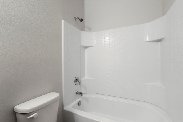 bathroom featuring toilet and shower / washtub combination