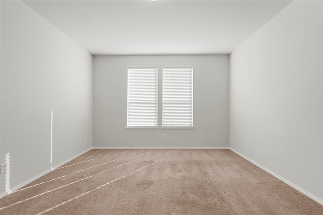 spare room with light carpet