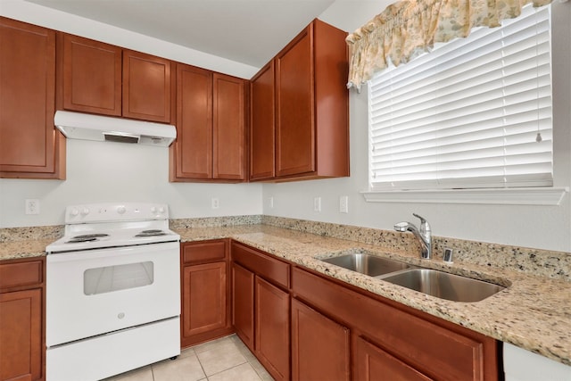 kitchen with light stone counters, sink, light tile patterned floors, and white electric range oven