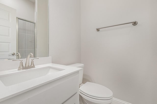 bathroom with toilet and vanity