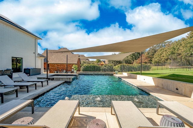 view of swimming pool featuring pool water feature and a patio