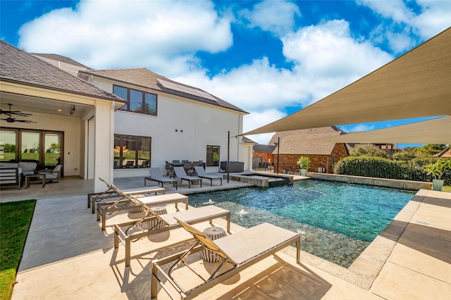 view of pool with pool water feature and a patio area