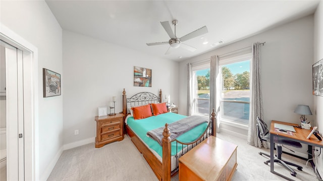 bedroom featuring ceiling fan and light colored carpet