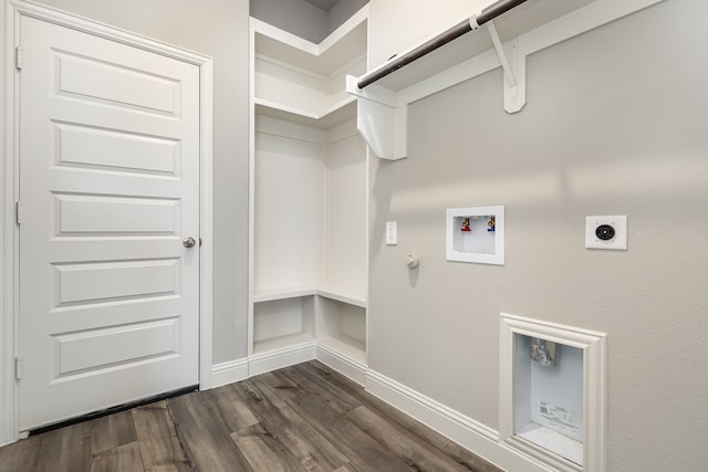 clothes washing area with hookup for a washing machine, dark hardwood / wood-style flooring, electric dryer hookup, and gas dryer hookup