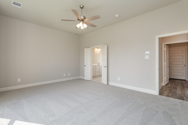 unfurnished bedroom with ceiling fan and carpet floors