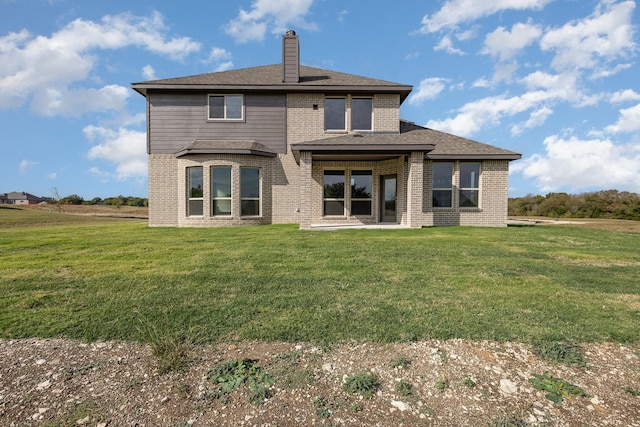 750 Serenity Ln, Red Oak, TX 75154 - back of property featuring brick siding, a lawn, and a chimney