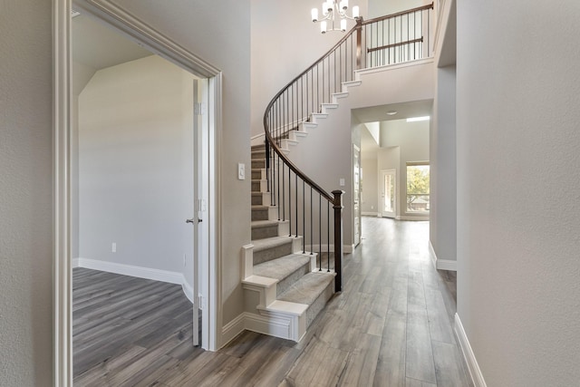750 Serenity Ln, Red Oak, TX 75154 - foyer with wood finished floors, a chandelier, stairway, baseboards, and a towering ceiling
